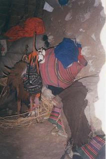 Dwelling house 04: Rucksack / backpack and
                      sleeping mat hanging on the roof