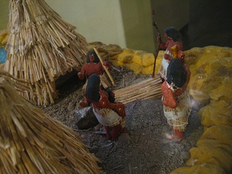 Model of Stone Age houses under
                                    construction