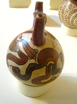 Ceramic bottle with painted eye
                                    and tongues 02