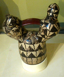 Ceramic bottle with graphic triangle
                            design